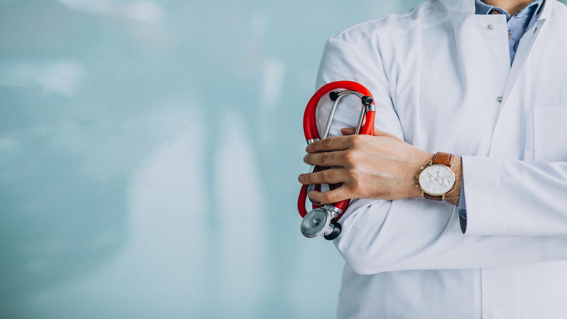 young-handsome-physician-in-a-medical-robe-with-stethoscope (1)